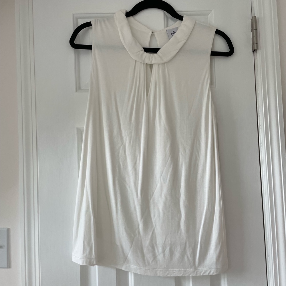 CAbi white long tank top with V-neck cut out and collar.